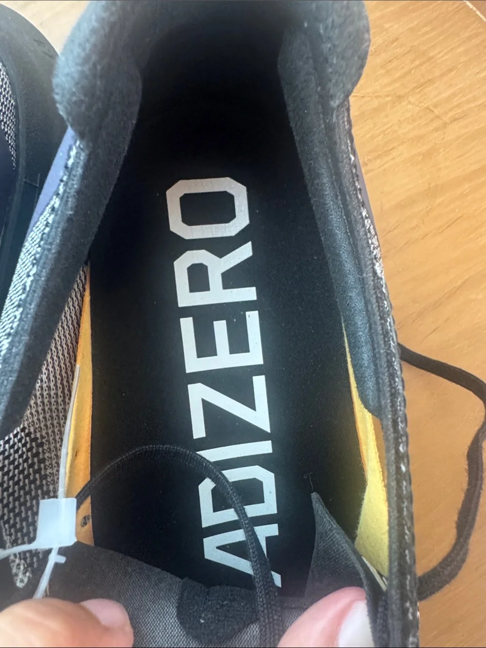 Adidas Adizero Boston 12 running shoe in the Core Black/Zero Metallic/Spark